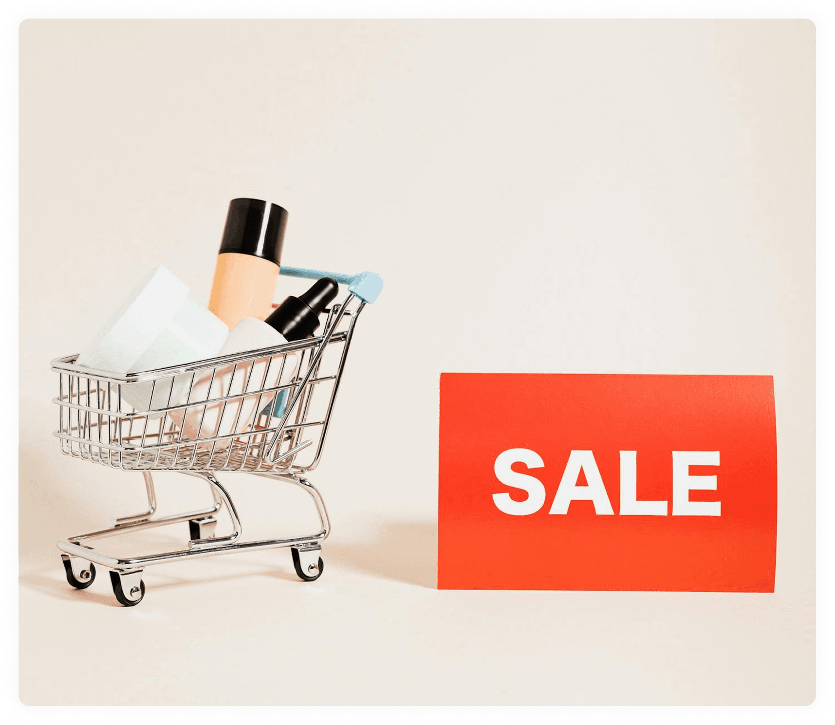 Mini shopping cart with products and a sale sign